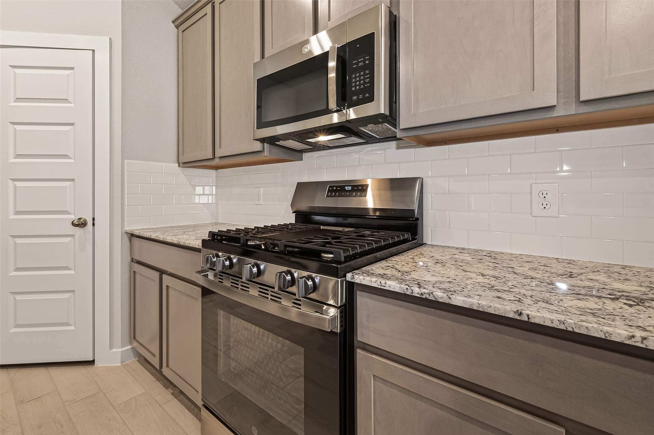 15710 Telge Road Cypress, TX 77429 - Photo 8 of 32 Modern kitchen with quality finishes and ample storage