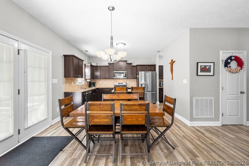 259 Bayleaf Drive Raeford, NC 28376 - Photo 12 of 46 a view of a dining room with furniture