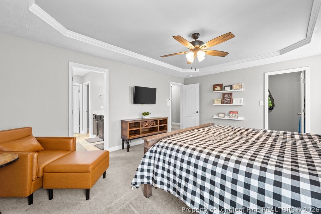 259 Bayleaf Drive Raeford, NC 28376 - Photo 18 of 46 a bedroom with furniture and a flat screen tv