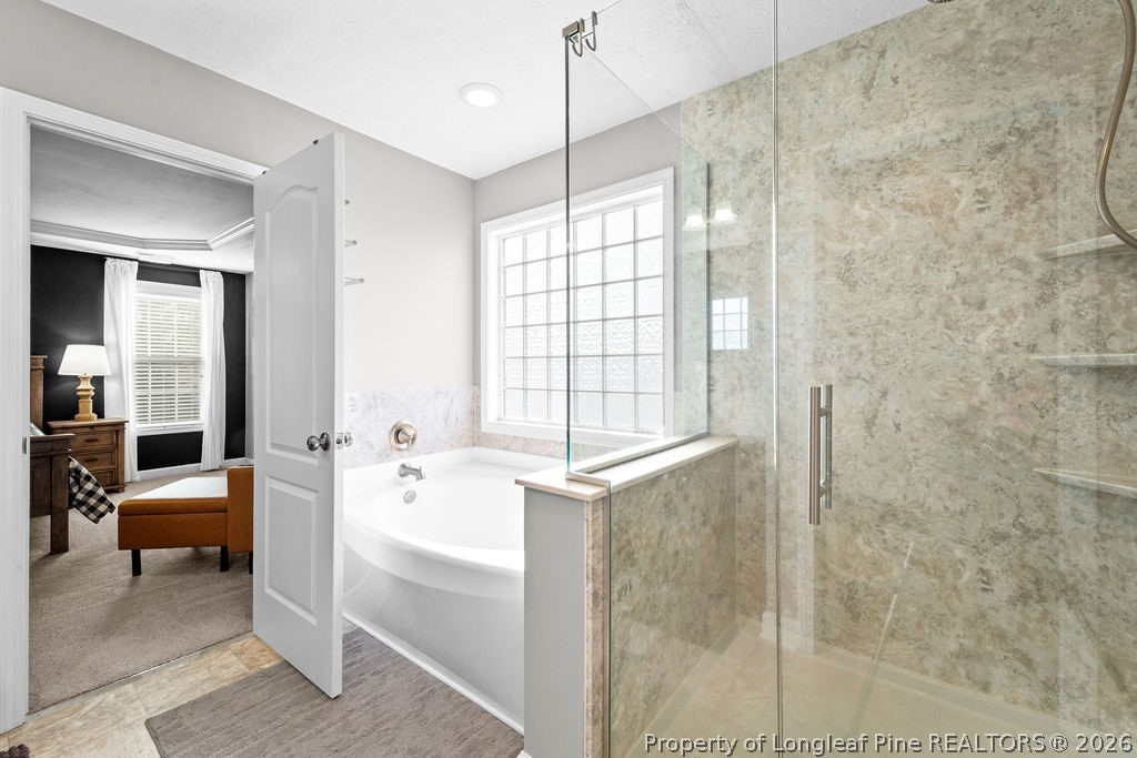 259 Bayleaf Drive Raeford, NC 28376 - Photo 19 of 46 a bathroom with a bathtub and a shower