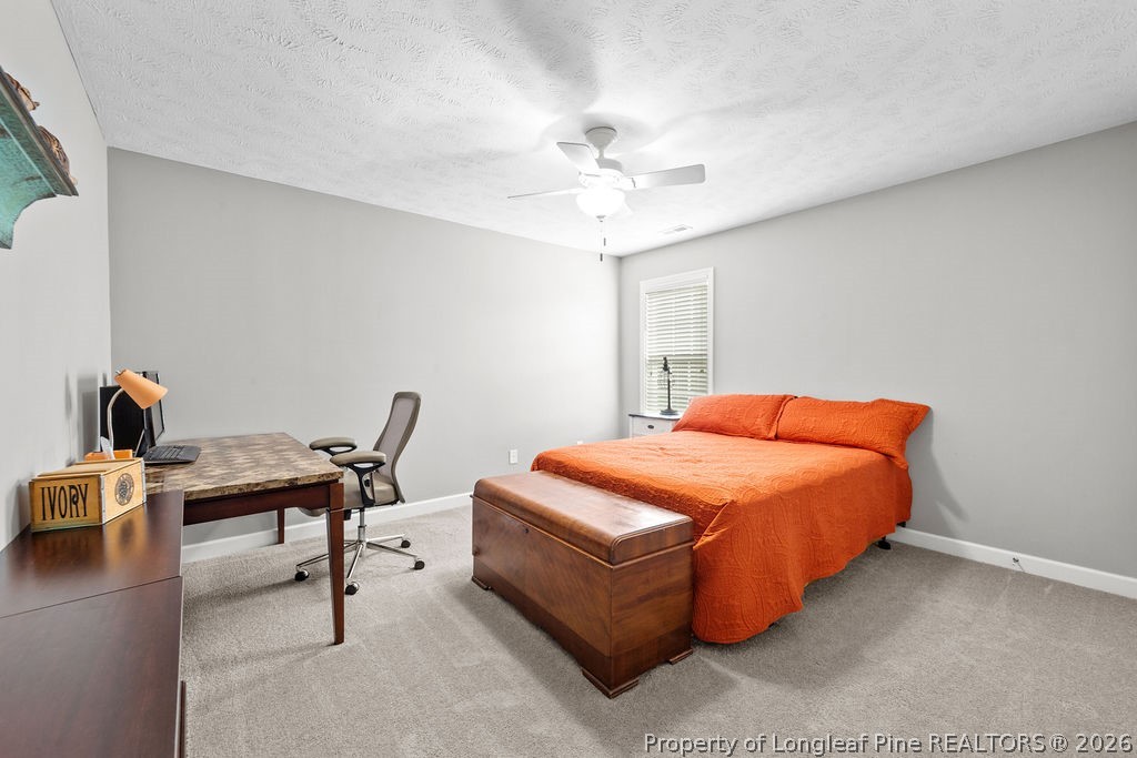 259 Bayleaf Drive Raeford, NC 28376 - Photo 24 of 46 a bedroom with a bed and a desk