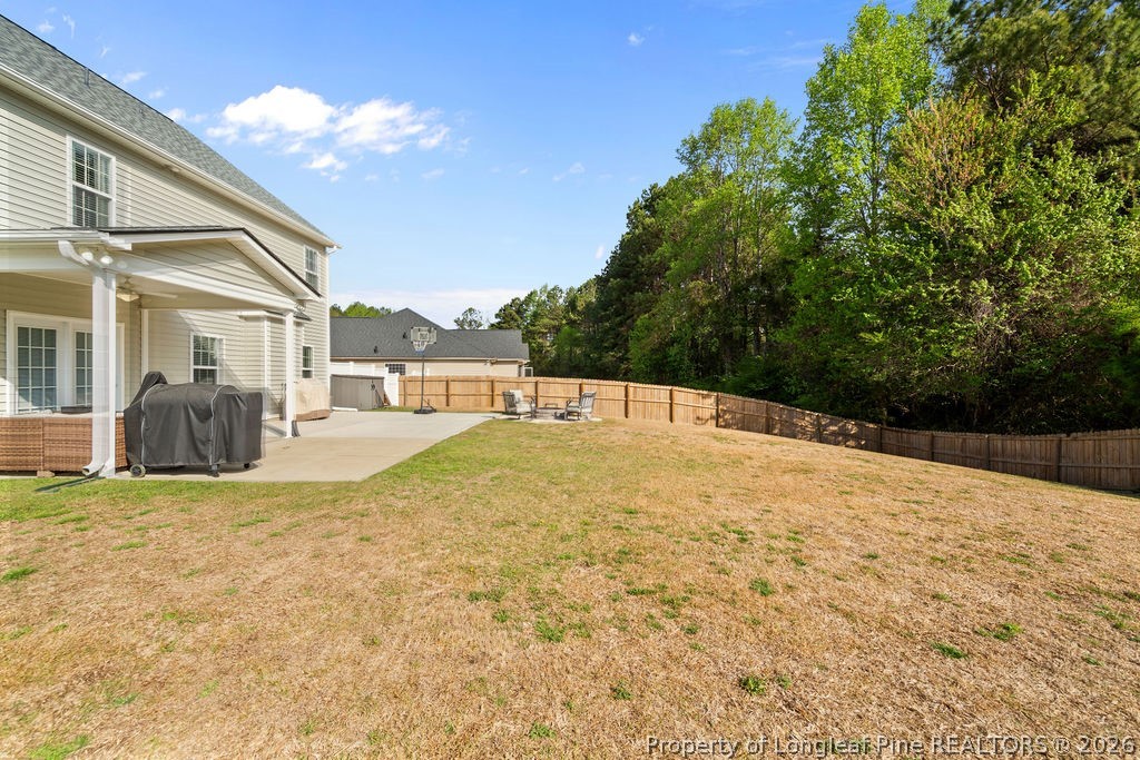 259 Bayleaf Drive Raeford, NC 28376 - Photo 36 of 46 a swimming pool with outdoor seating and yard