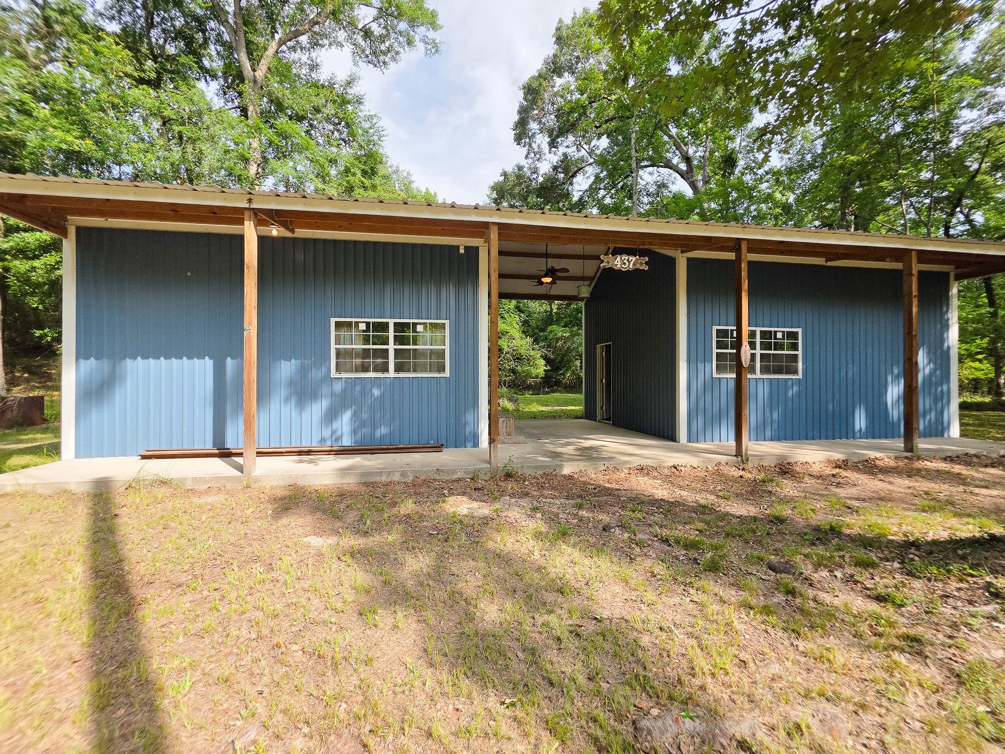 437 East Lumbermans Road Onalaska, TX 77360 - Photo 1 of 15 a house with trees in the background