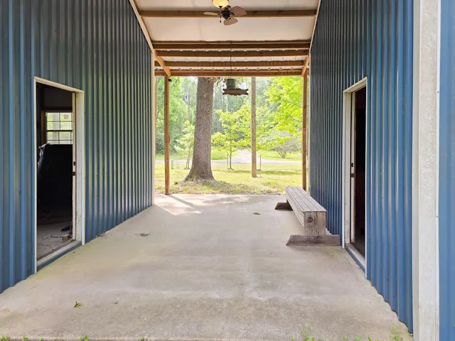 a view of an empty room with a fireplace