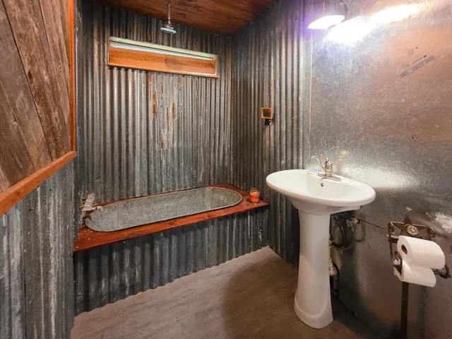 a bathroom with a sink and mirror