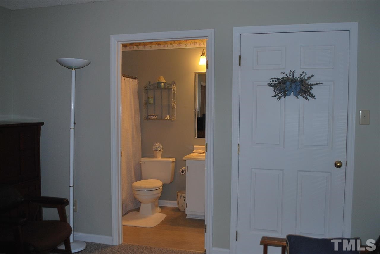 725 Charleston Road, Unit 725 Raleigh, NC 27606 - Photo 15 of 17 View of the full bath in this 2nd master. Closet is behind the door to the right. Bedroom