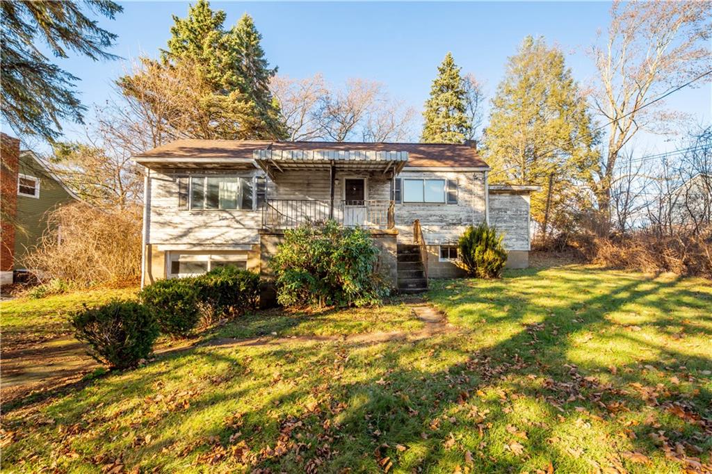 150 Pear Orchard Road Coraopolis, PA 15108 - Photo 2 of 13 a view of a house with a yard