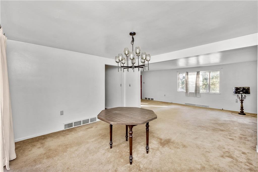 150 Pear Orchard Road Coraopolis, PA 15108 - Photo 7 of 13 a living room with a chandelier