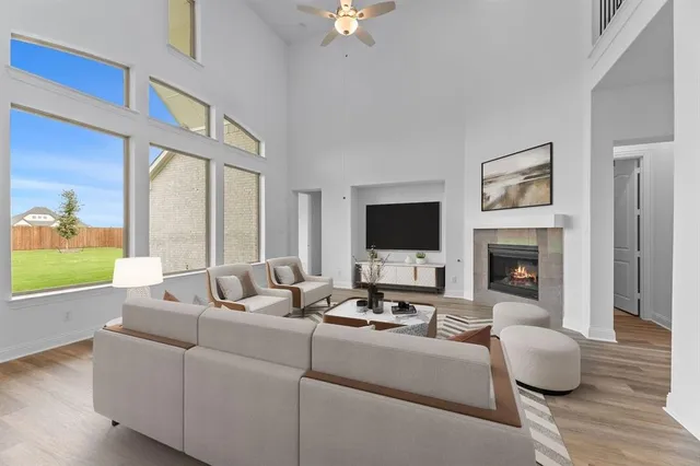 a living room with furniture fireplace and a flat screen tv