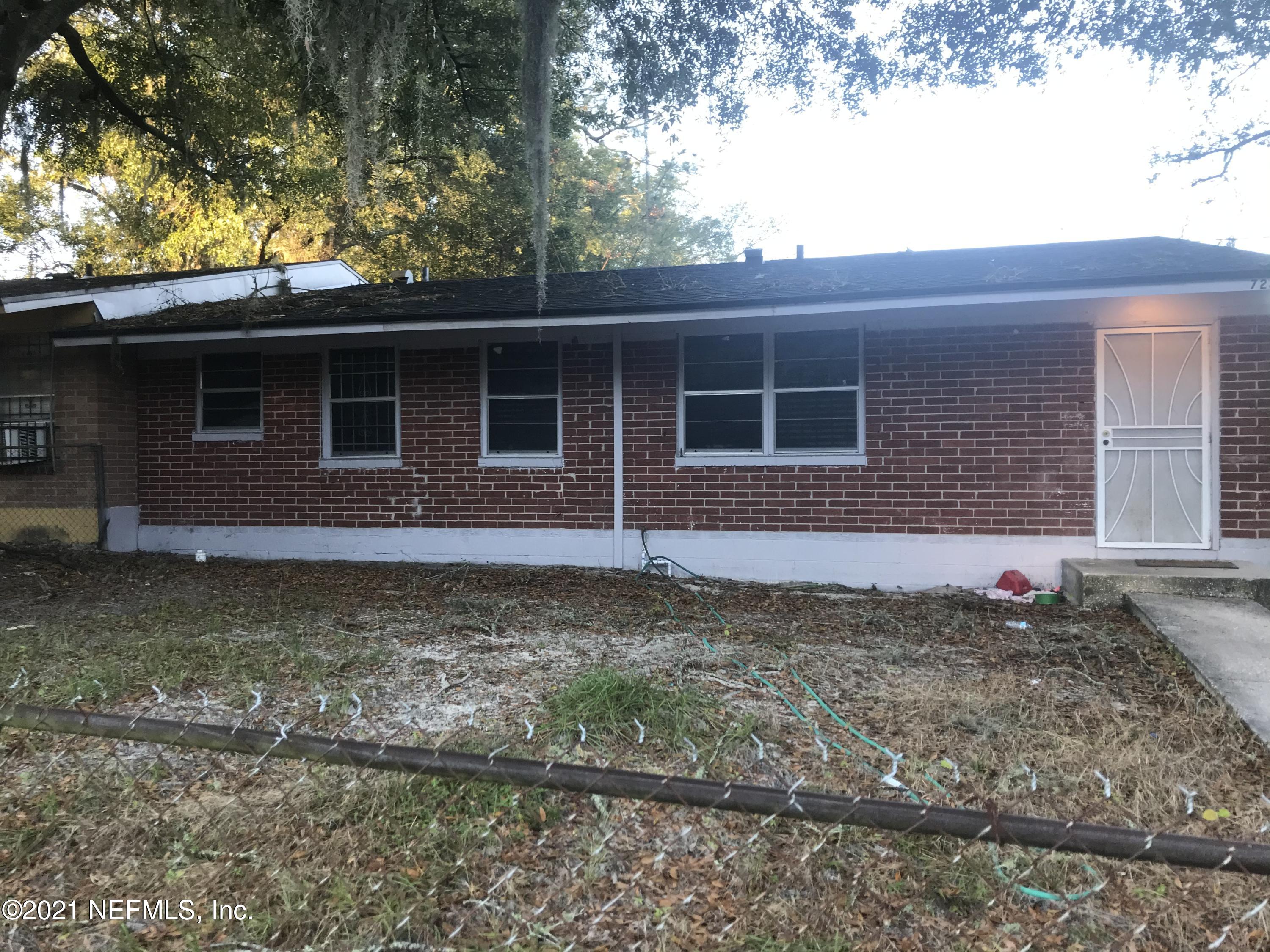 7232 Rutledge Pearson Drive Jacksonville, FL 32209 - Photo 2 of 11 a front view of a house