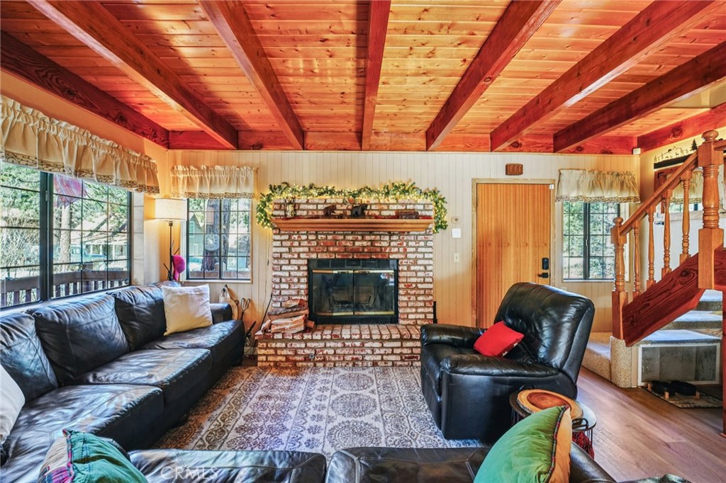 1847 Thrush Road Wrightwood, CA 92397 - Photo 4 of 33 a living room with furniture and a fireplace