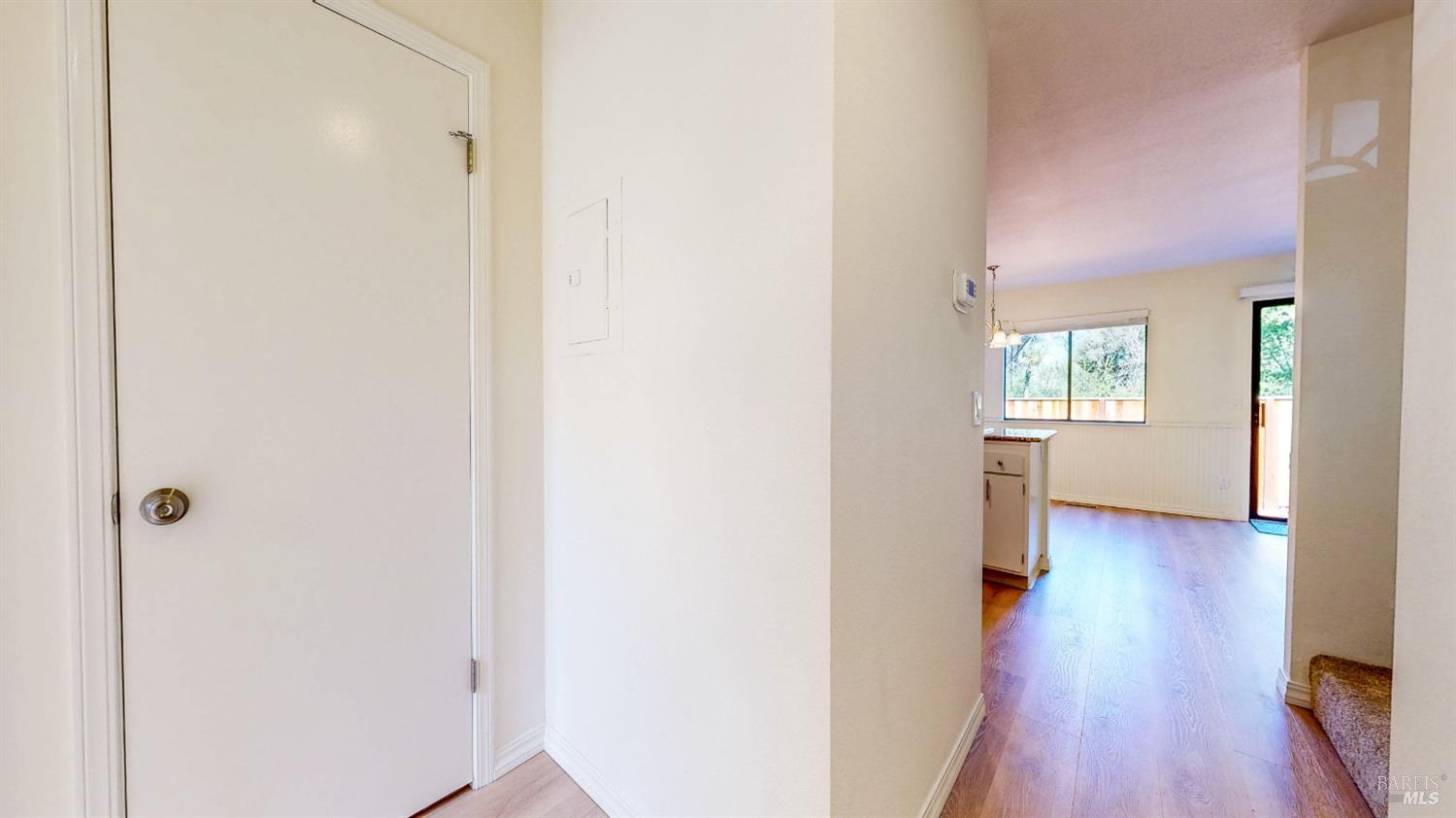 158 North Dutton Avenue Santa Rosa, CA 95401 - Photo 7 of 50 a view of a hallway with wooden floor and windows