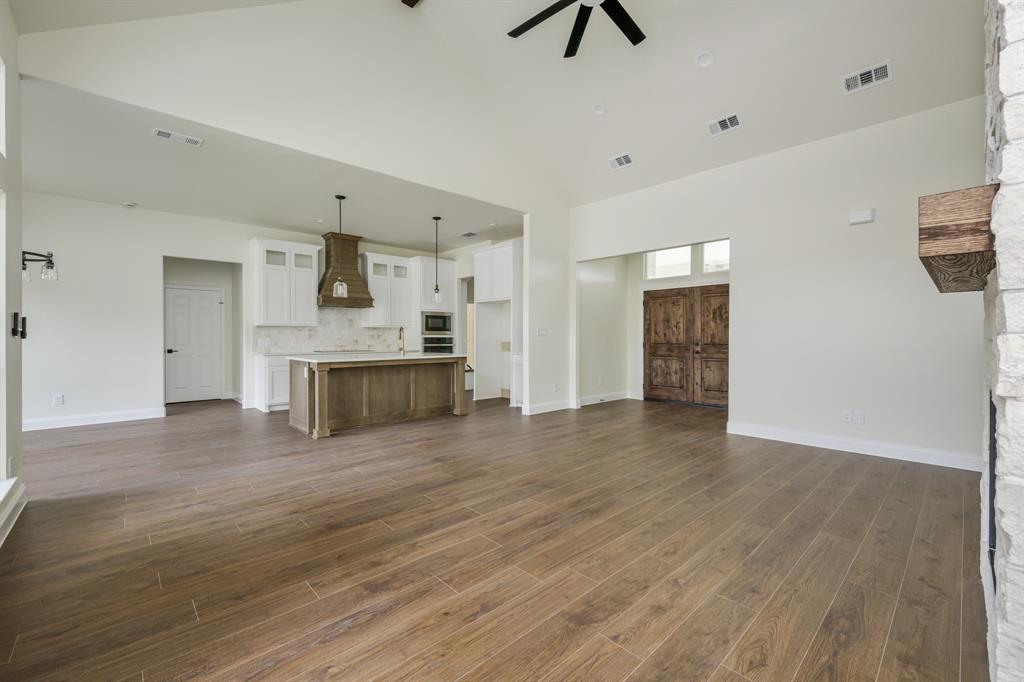 1844 County Road 2320 Terrell, TX 75160 - Photo 13 of 40 a view of a kitchen with a sink and a refrigerator