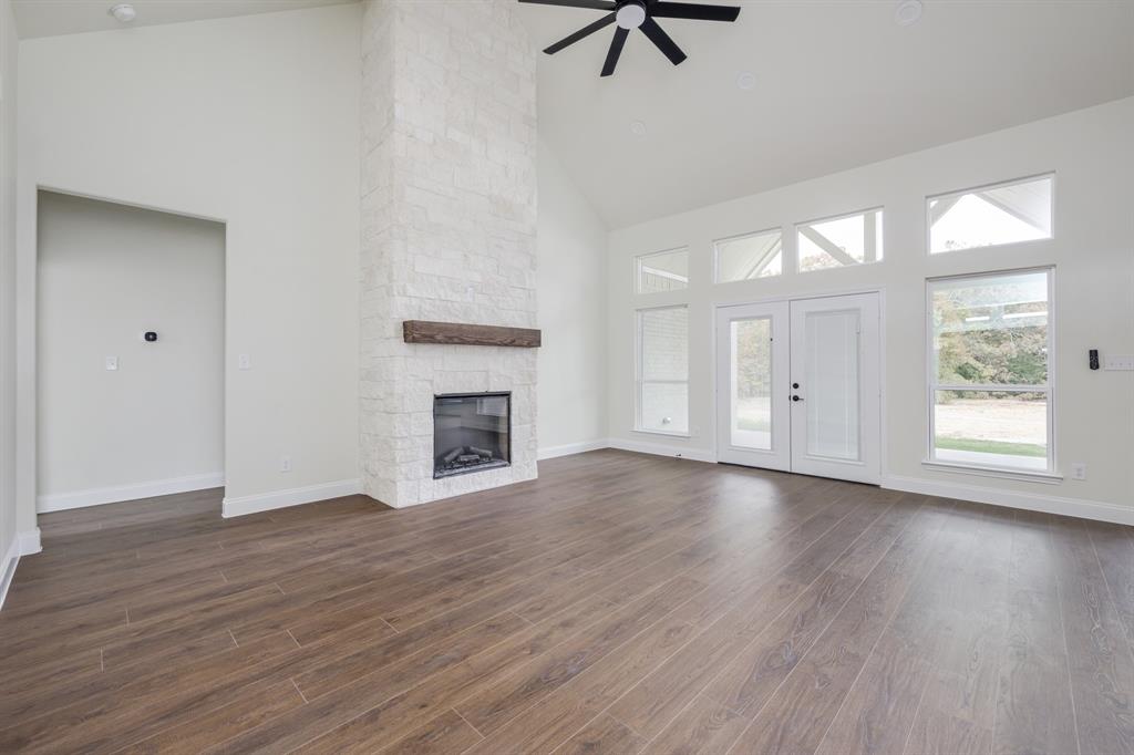 1844 County Road 2320 Terrell, TX 75160 - Photo 15 of 40 a view of a livingroom with wooden floor and a window