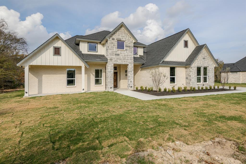 1844 County Road 2320 Terrell, TX 75160 - Photo 2 of 40 a front view of a house with a yard