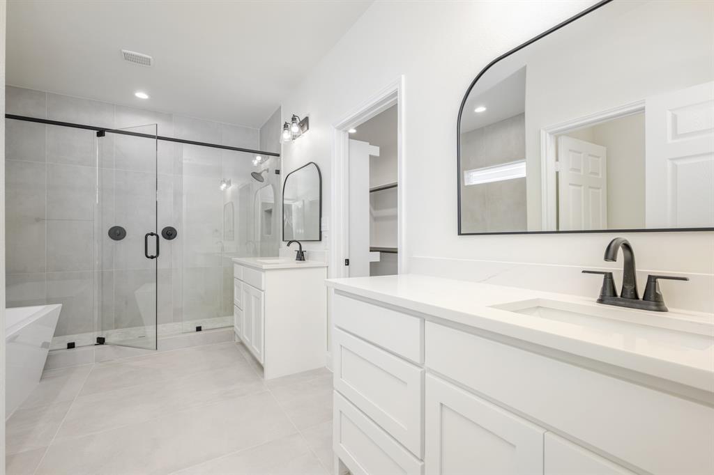 1844 County Road 2320 Terrell, TX 75160 - Photo 27 of 40 a bathroom with a sink a toilet and shower