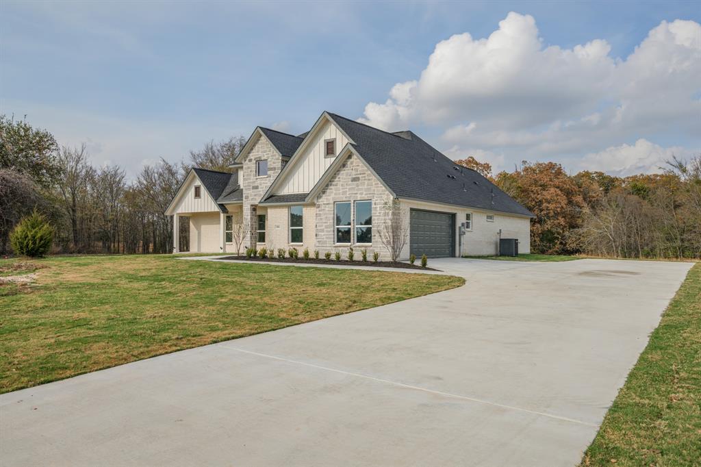 1844 County Road 2320 Terrell, TX 75160 - Photo 4 of 40 a view of house with garden space and trees around
