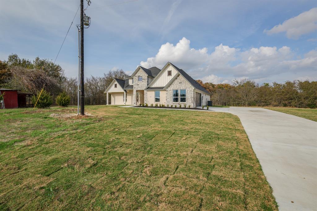 1844 County Road 2320 Terrell, TX 75160 - Photo 5 of 40 a big house with a big yard and large trees