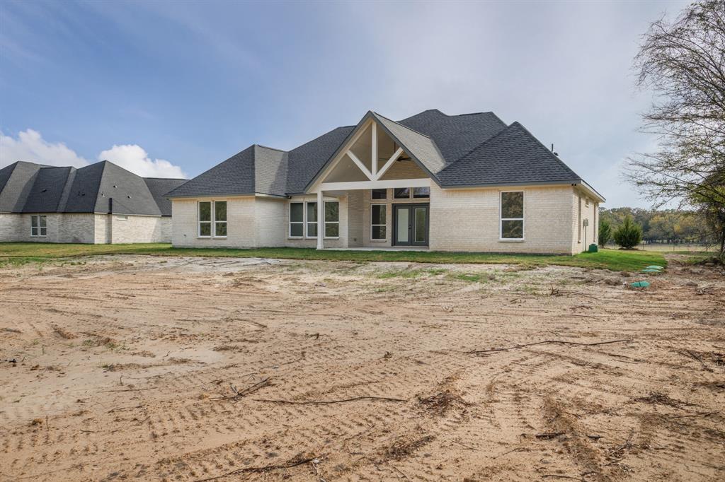 1844 County Road 2320 Terrell, TX 75160 - Photo 9 of 40 a front view of a house with a yard