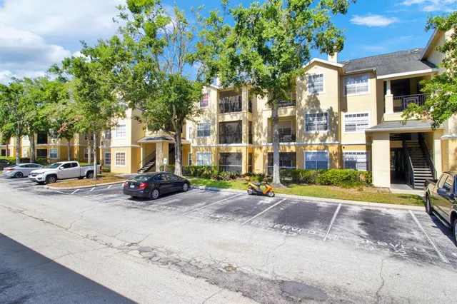 a view of a parked cars in front of a building