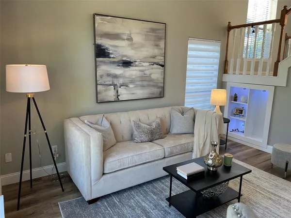 a living room with furniture and a window