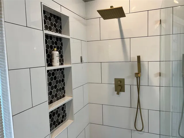 a kitchen with a refrigerator and cabinets