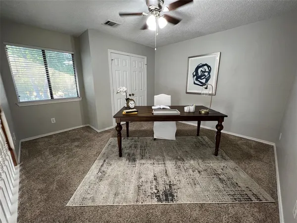 a view of a workspace with furniture