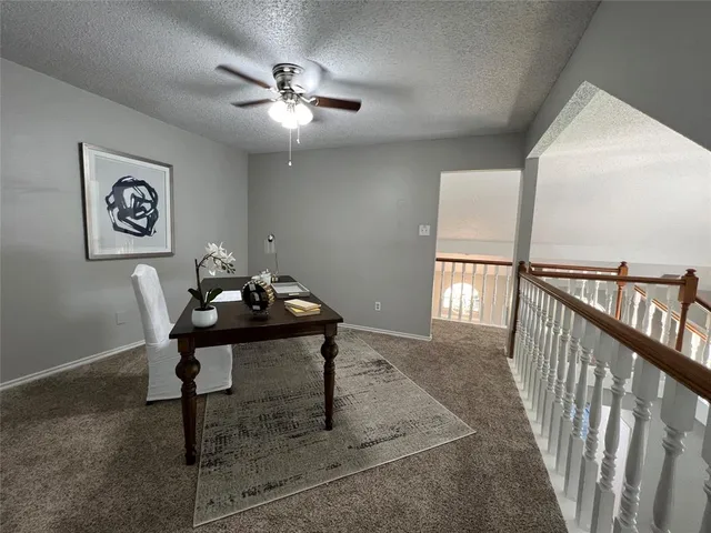 a view of a workspace with furniture