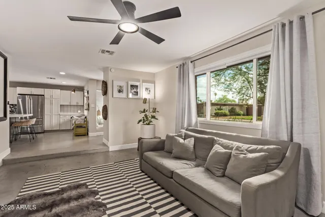 a living room with furniture and a window