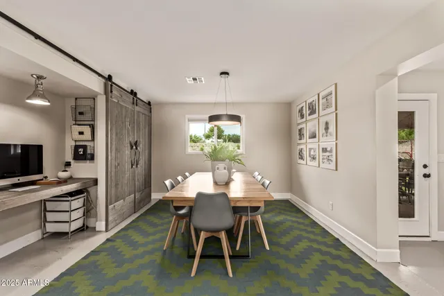 a dining room with furniture and window