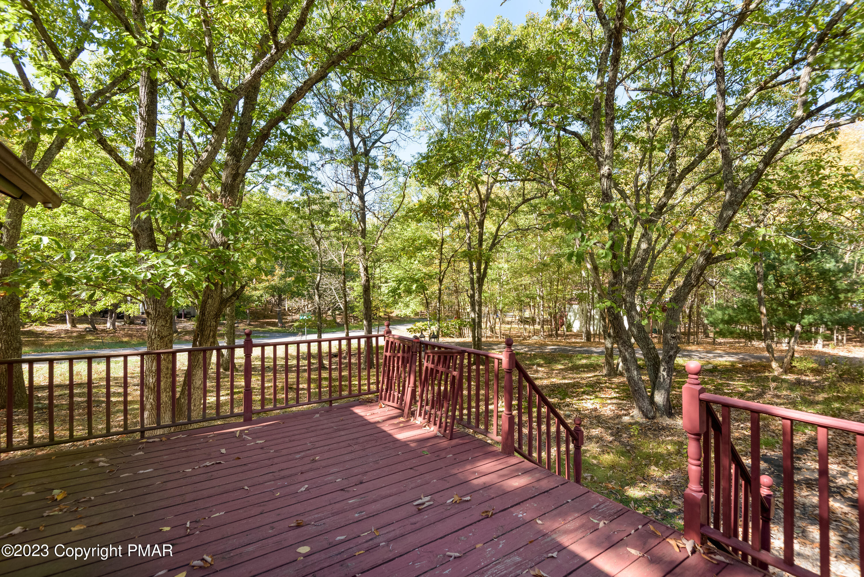 2206 Chatham Drive Bushkill, PA 18324 - Photo 13 of 25 a view of a deck with wooden floor and fence