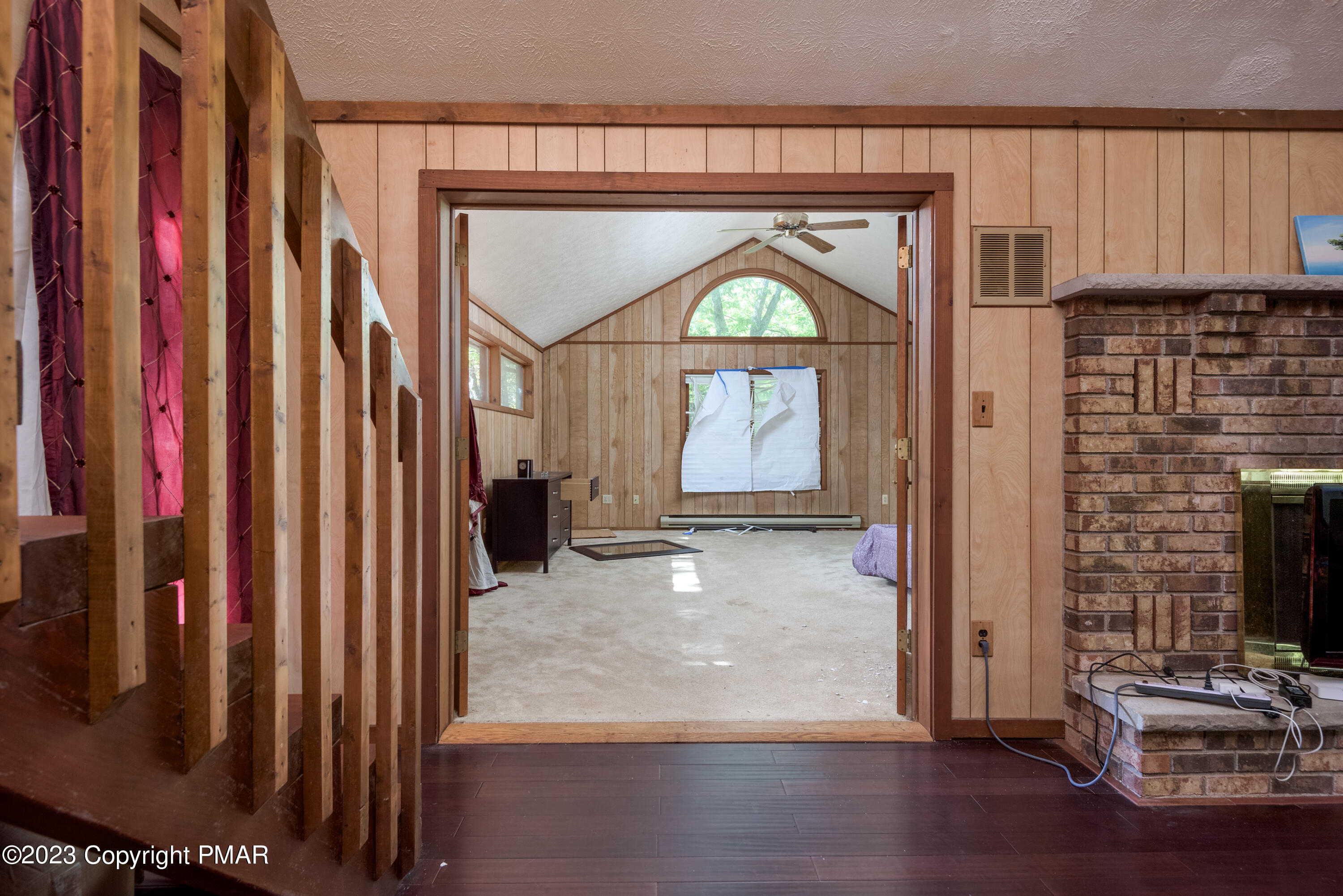 2206 Chatham Drive Bushkill, PA 18324 - Photo 17 of 25 a view of a livingroom with wooden floor and furniture