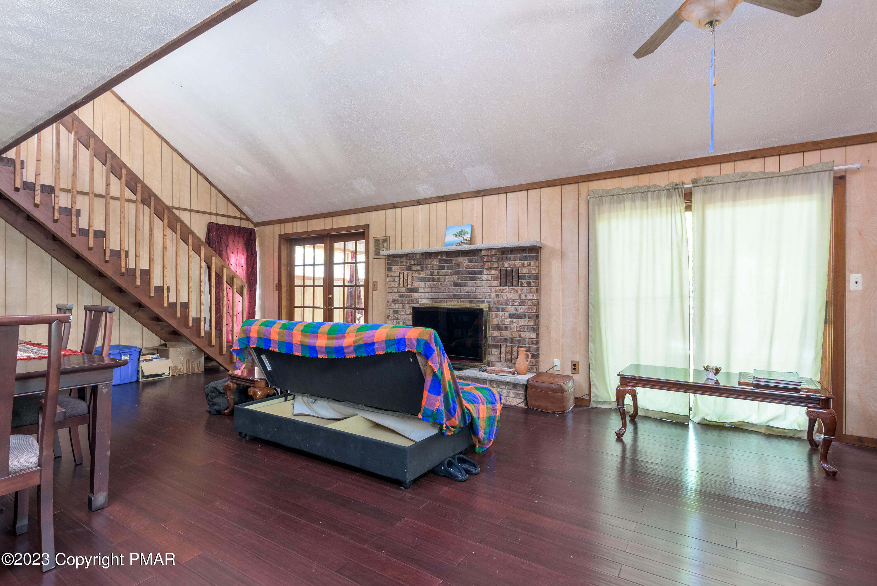 2206 Chatham Drive Bushkill, PA 18324 - Photo 2 of 25 a living room with furniture wooden floor and a fireplace