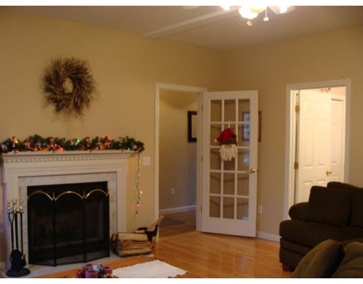 17 Boundary Stone Road Sutton, MA 01590 - Photo 11 of 24 a living room with furniture and a fireplace