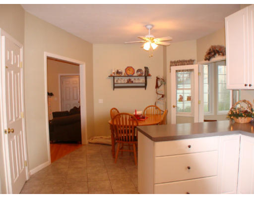 17 Boundary Stone Road Sutton, MA 01590 - Photo 14 of 24 a dining room with furniture and chandelier