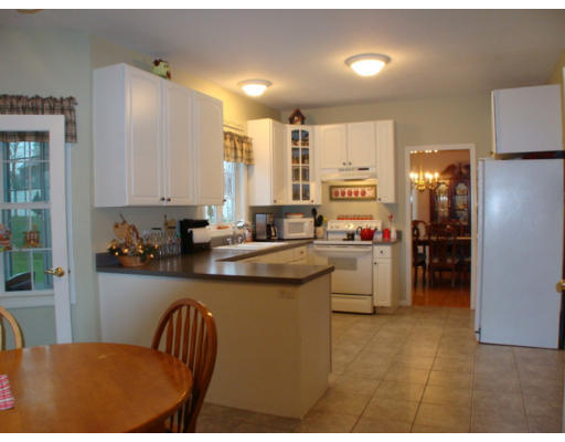 17 Boundary Stone Road Sutton, MA 01590 - Photo 15 of 24 a kitchen with stainless steel appliances granite countertop a sink a stove and refrigerator