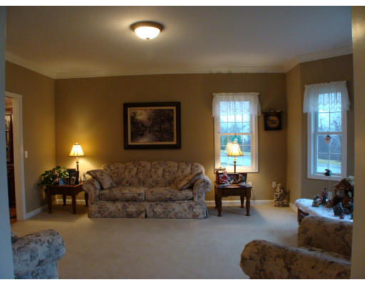 17 Boundary Stone Road Sutton, MA 01590 - Photo 16 of 24 a living room with furniture and a large window