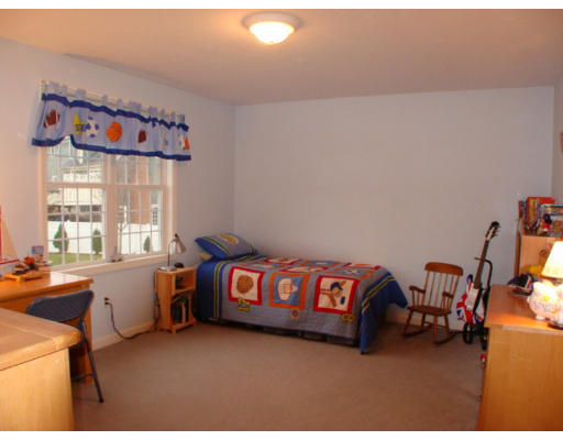 17 Boundary Stone Road Sutton, MA 01590 - Photo 17 of 24 a room with furniture and a chandelier