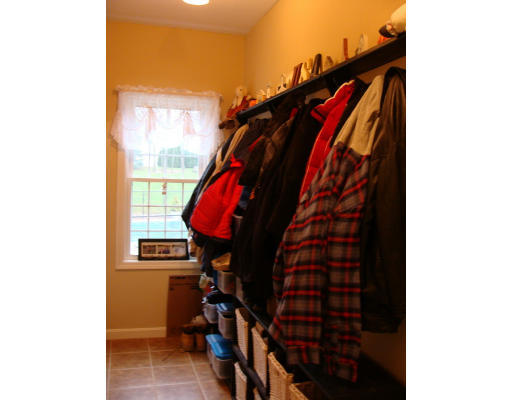 17 Boundary Stone Road Sutton, MA 01590 - Photo 7 of 24 a view of walk in closet with clothes and shoes