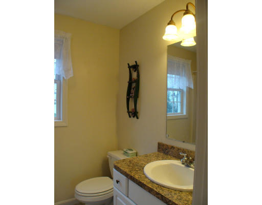 17 Boundary Stone Road Sutton, MA 01590 - Photo 9 of 24 a bathroom with a granite countertop sink and a mirror