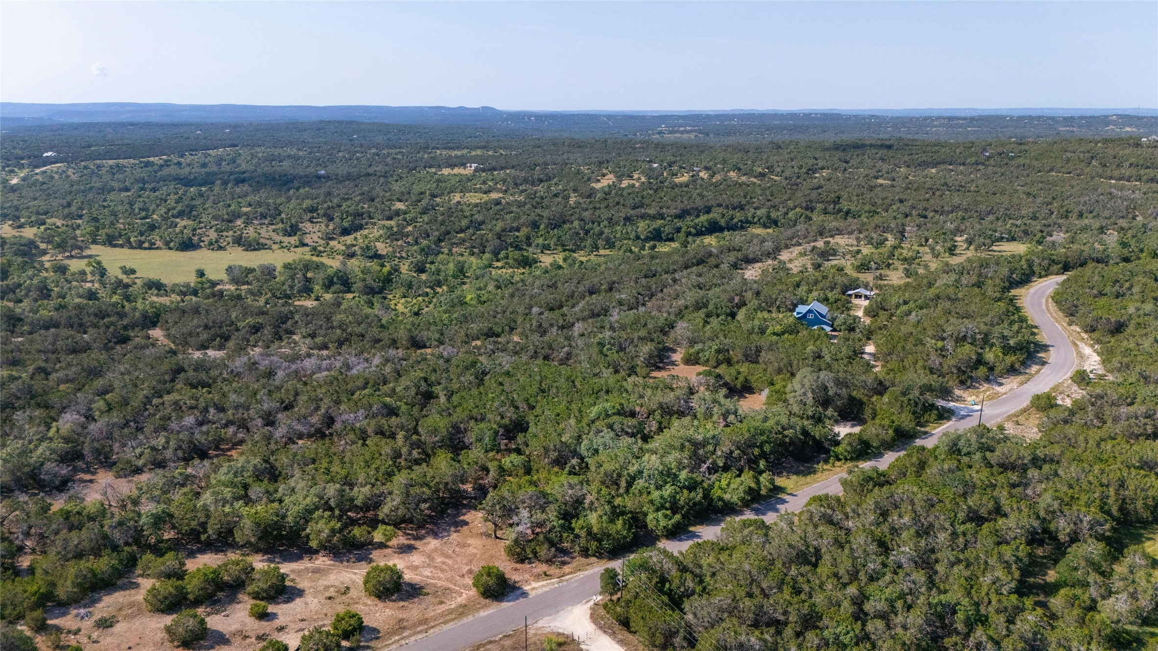4501 Cottonwood Road Wimberley, TX 78676 - Photo 4 of 7 an aerial view of a house with a yard