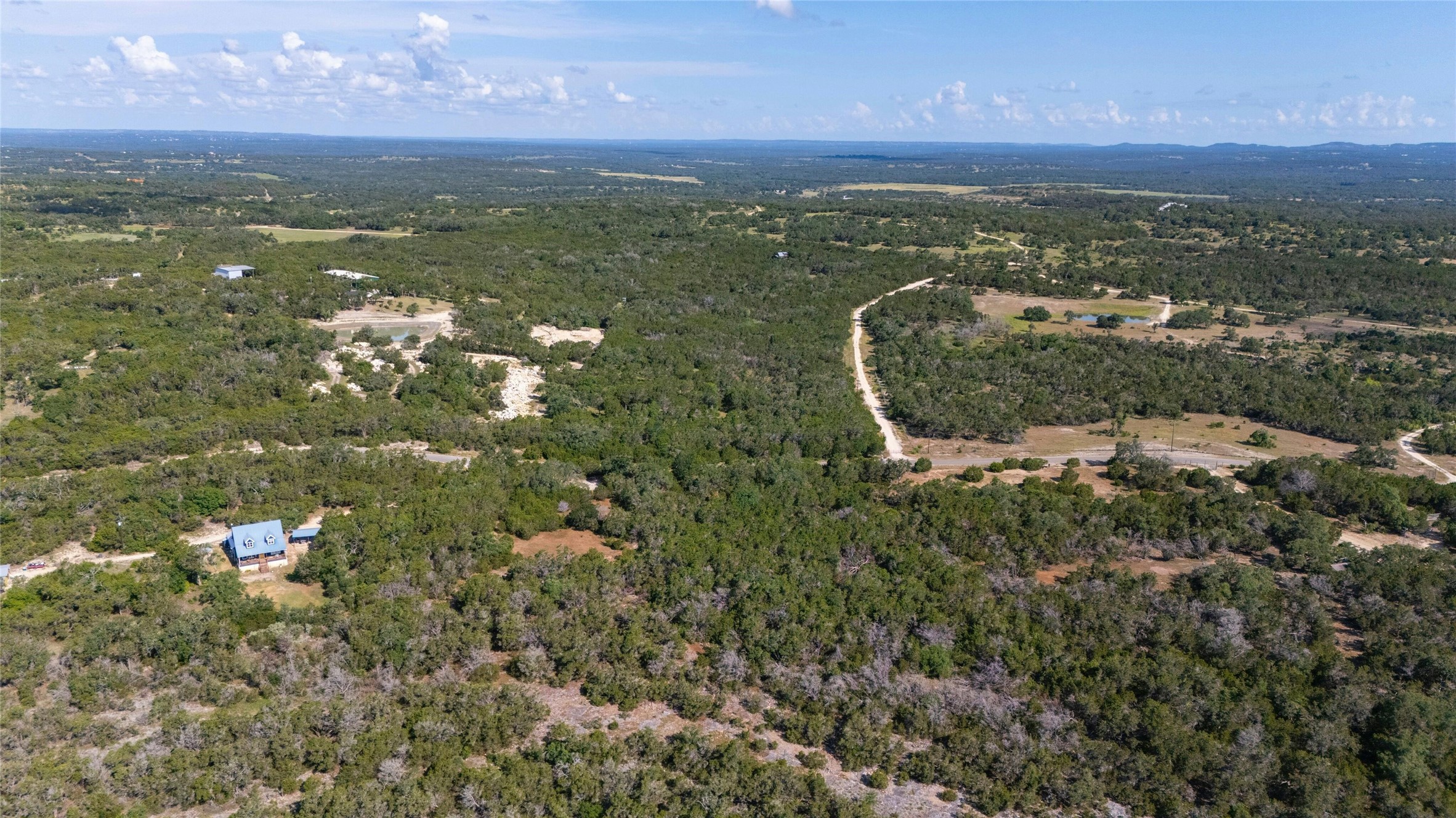4501 Cottonwood Road Wimberley, TX 78676 - Photo 6 of 7 an aerial view of a houses with a yard