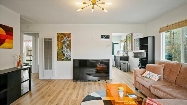 a living room with furniture fireplace and flat screen tv