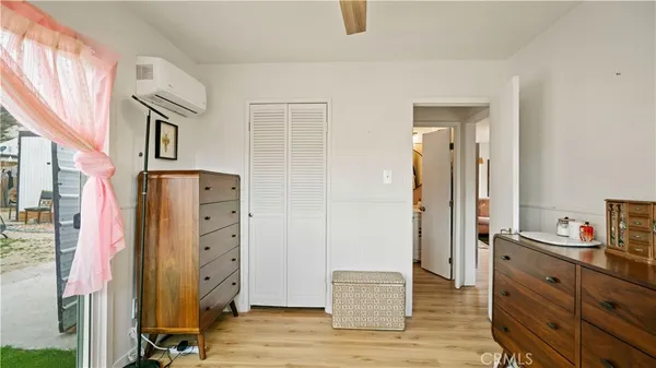 a view of walk in closet with empty room