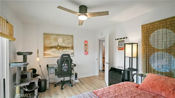 a bedroom with furniture and a window