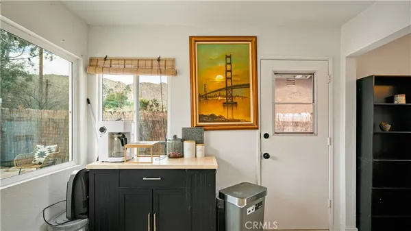 a bathroom with a sink mirror and a shower