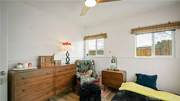 a bedroom with furniture and a window