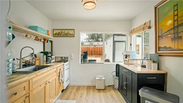 a bathroom with a toilet a sink and a window