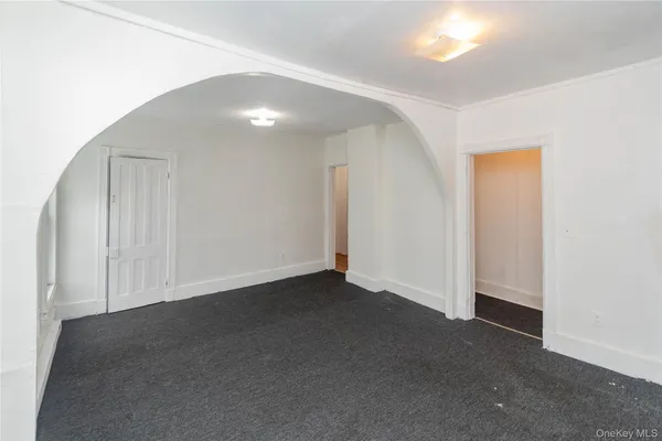 an empty room with closet area