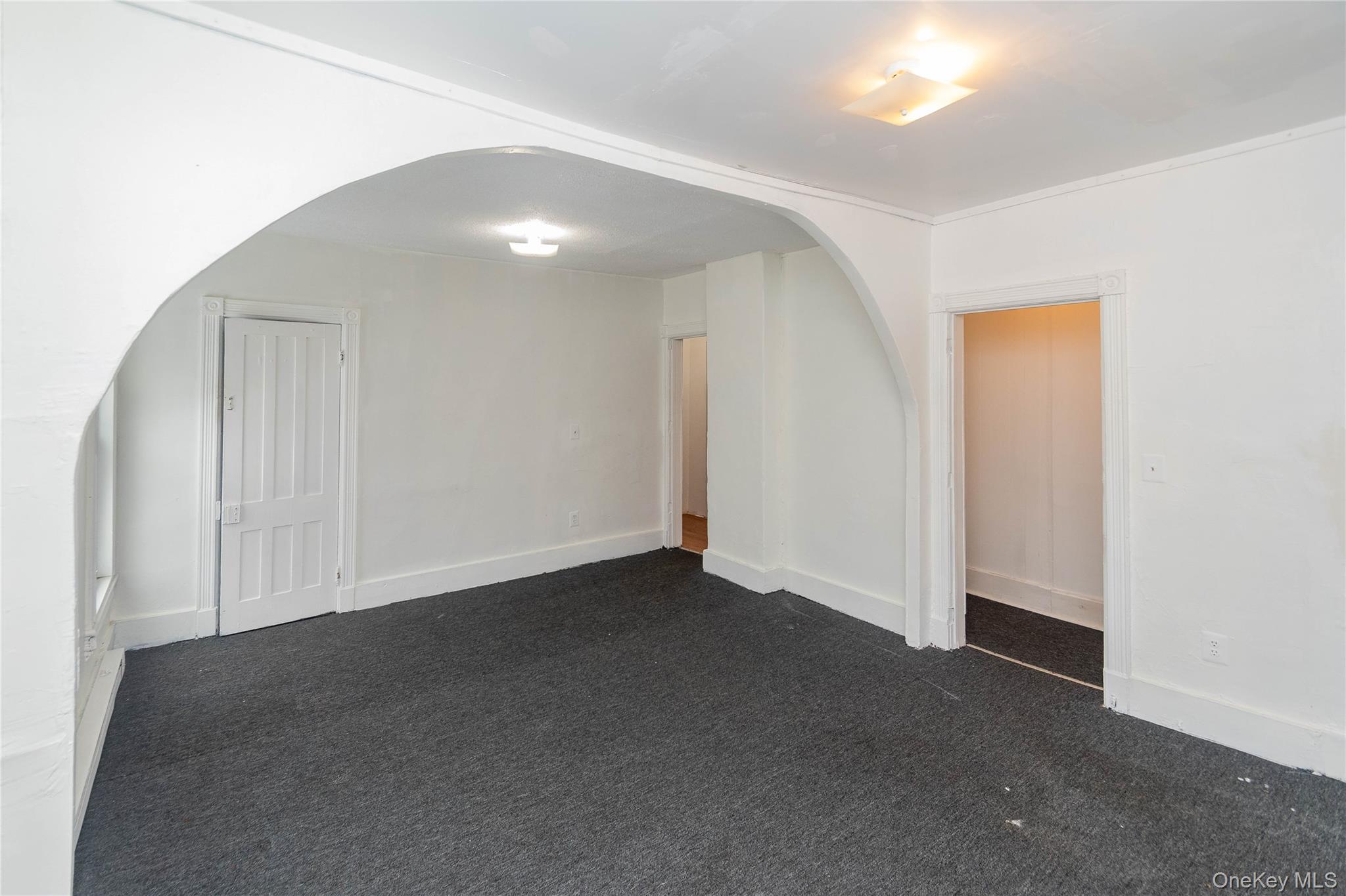 41 Edgar Street Liberty, NY 12754 - Photo 26 of 42 Spare room with dark colored carpet and arched walkways